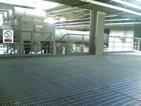 This is a corner of power station with wide steel grating floor.
