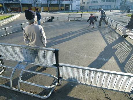 Short steel grating surrounds into a small football field.