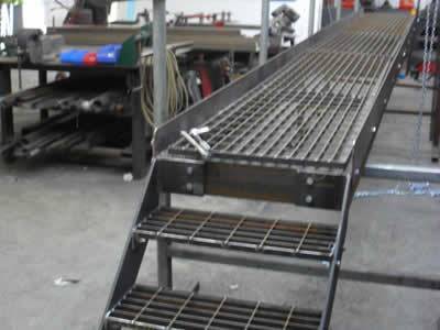 Carbon steel grating walkway with  galvanized handrail in steel plant.